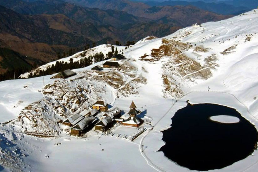 snow covered view of prashar lake