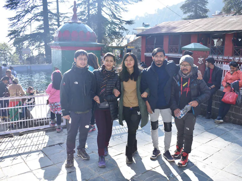 Tourists exploring the serene temple grounds of McLeod Ganj