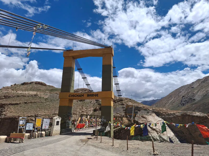 Yellow suspension bridge at Chicham spanning a deep gorge in Spiti Valley