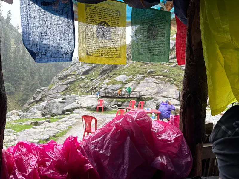Tibetan colorful prayer flags fluttering near mountain tea stall along Kareri Lake trail