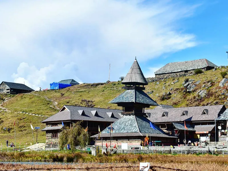 Traditional three-tiered Pagoda architecture of ancient Prashar Rishi temple beside the lake