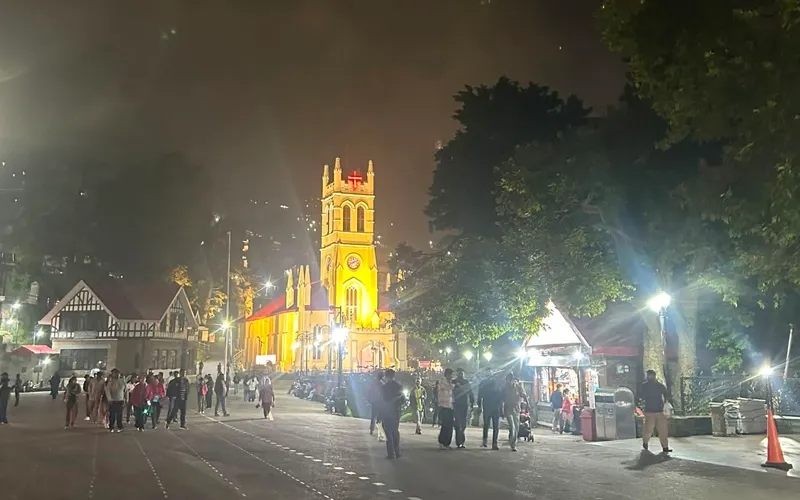 Illuminated Christ Church and evening crowd on the Ridge Shimla
