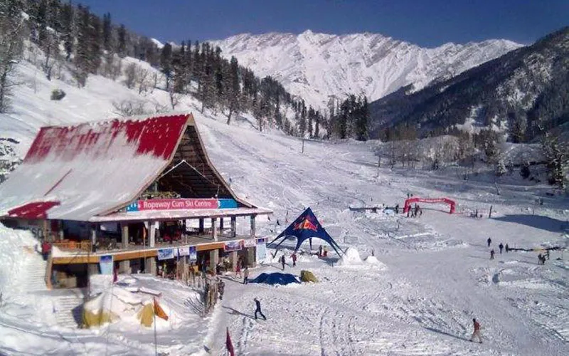 Snow-covered mountain slope and alpine huts in Solang Valley Manali